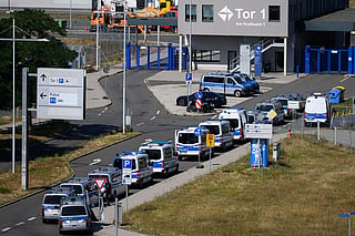 Police vehicles are parked at Leipzig/Halle Airport, where investigations are underway following the drone incident that occurred early Wednesday morning, in Schkeuditz, Germany, on Thursday Aug. 6, 2026. 