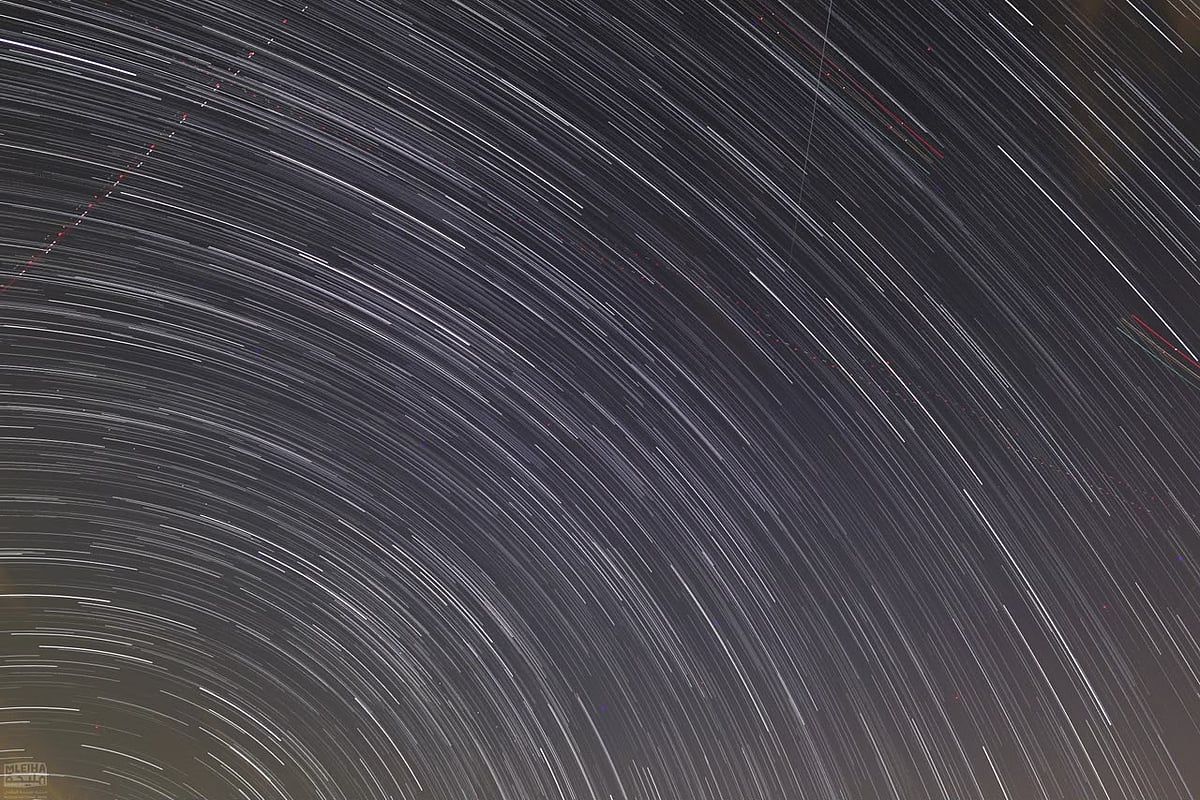 Star‑trail composition from the event, featuring meteors within the frame.