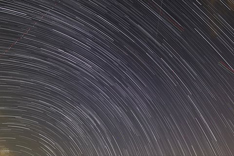 Star‑trail composition from the event, featuring meteors within the frame.