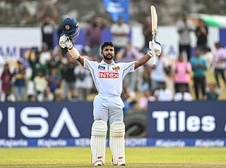 Sri Lanka's Sonal Dinusha celebrates after scoring a century during the third day of the first Test match against India at the Galle International Stadium in Galle on August 17, 2026.