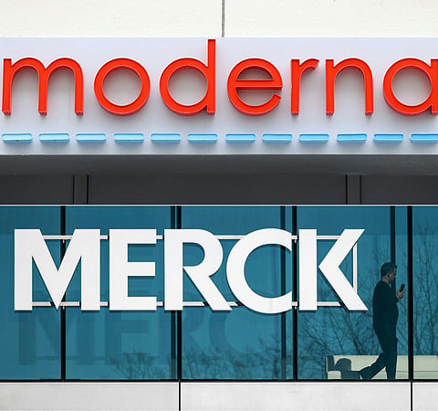 This combination of pictures created on August 19, 2026 shows the Moderna logo at their headquarters on May 8, 2020 in Cambridge, Massachusetts and the Merck logo at their headquarters on February 5, 2024 in Rahway, New Jersey.