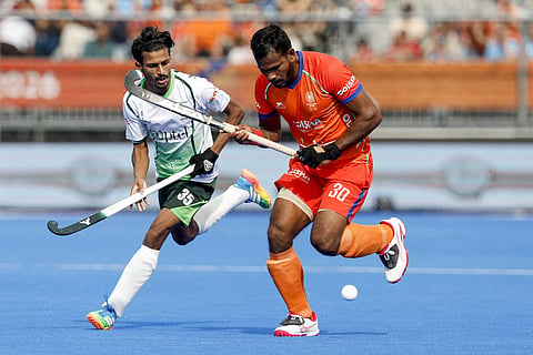 India's Amit Rohidas (R) and Pakistan's Muhammad Ammad (L) fight for the ball during the 2026 FIH Men's Hockey World Cup group stage match between Pakistan and India at the Wagener Stadium in Amstelveen, western Netherlands, on August 19, 2026.