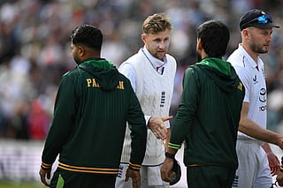 England's Joe Root (C) shakes hands with Pakistan players after England win by an Innings and 103 runs on day three of the first test match between England and Pakistan at Headingley cricket ground in Leeds, northern England on August 21, 2026.