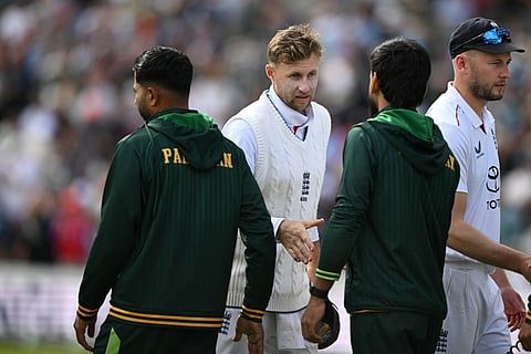 England's Joe Root (C) shakes hands with Pakistan players after England win by an Innings and 103 runs on day three of the first test match between England and Pakistan at Headingley cricket ground in Leeds, northern England on August 21, 2026.