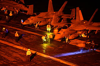 This US Navy handout photograph shows F/A-18 Super Hornets standing ready for launch on the flight deck of Nimitz-class aircraft carrier USS George Washington while operating in the Indian Ocean. File photo released on August 18, 2026.