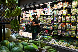 People shop for groceries at a supermarket in Manhattan on August 25, 2026 in New York City.