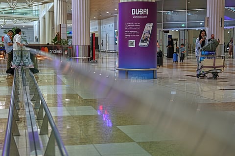 Passengers leave the baggage claim hall at Terminal 3 of Dubai International Airport in Dubai, United Arab Emirates, Wednesday, Aug. 26, 2026.