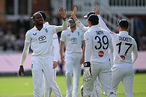 England's Jofra Archer (L) celebrates with teammates after bowling Pakistan's Ali Usman on day two of the second Test match  at Lord's cricket ground in Leeds, London on August 28, 2026.