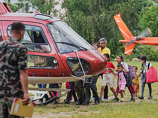 A girl cries as she boards a helicopter with her family after being rescued from their village, which was cur off by flash flooding in Nepal's Nuwakot district, on Friday, Aug. 28, 2026. 