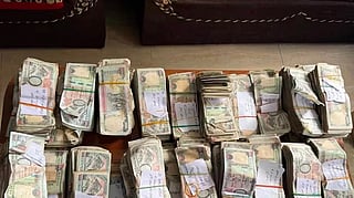 Flood carried the safe downstream before police say locals broke it open and took cash.