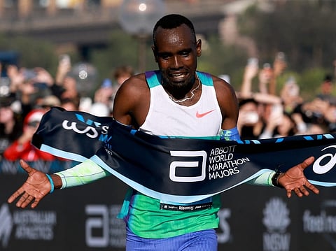 Ethiopia's Addisu Gobena celebrates as he crosses the finish line to win the 2026 Sydney Marathon in Sydney on August 30, 2026.