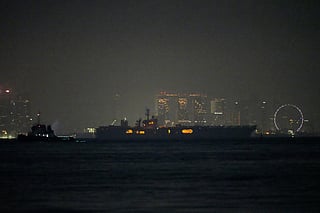 The U.S. Navy aircraft carrier USS Abraham Lincoln sails past Singapore as seen from Batam, Indonesia, Sunday, Aug. 30, 2026. (AP Photo/Dita Alangkara)