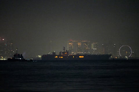 The U.S. Navy aircraft carrier USS Abraham Lincoln sails past Singapore as seen from Batam, Indonesia, Sunday, Aug. 30, 2026. (AP Photo/Dita Alangkara)