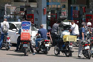 Motorists queue for fuel in Iran as economic pressure and uncertainty over petrol prices add to concerns about renewed public unrest.