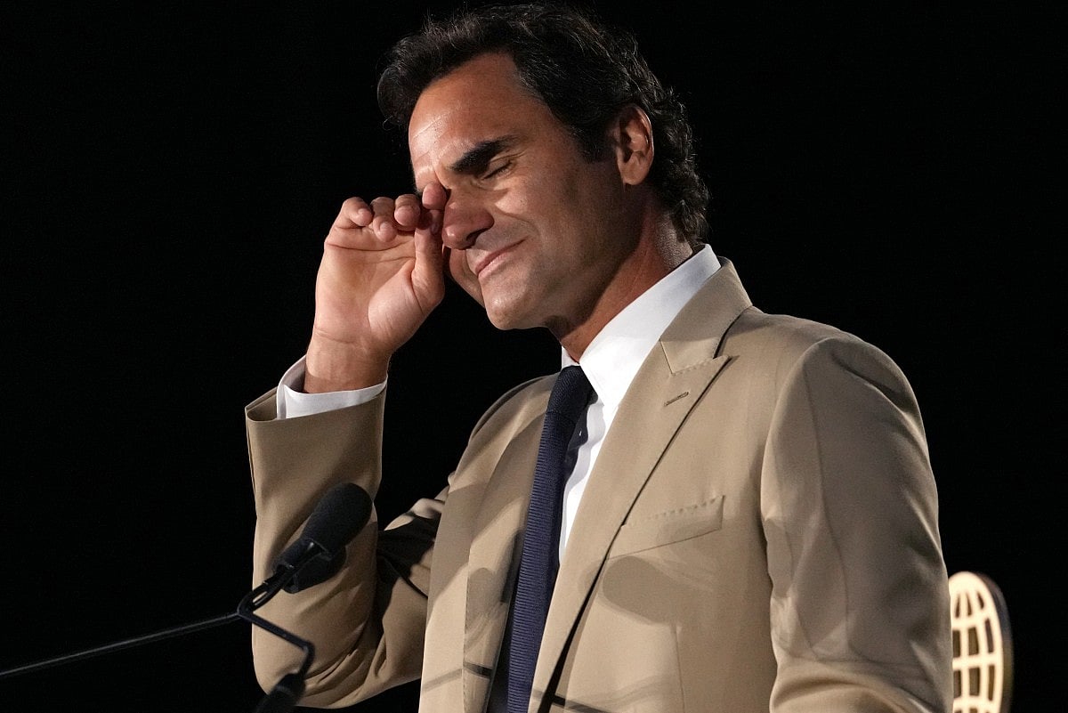Roger Federer tries to hold back his tears during his induction ceremony at the International Tennis Hall of Fame, Saturday, August 29, 2026, in Newport, R.I. 