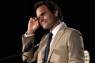 Roger Federer tries to hold back his tears during his induction ceremony at the International Tennis Hall of Fame, Saturday, August 29, 2026, in Newport, R.I. 