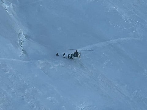 Pilots evacuate the patient from steep mountain slope with no space to land.