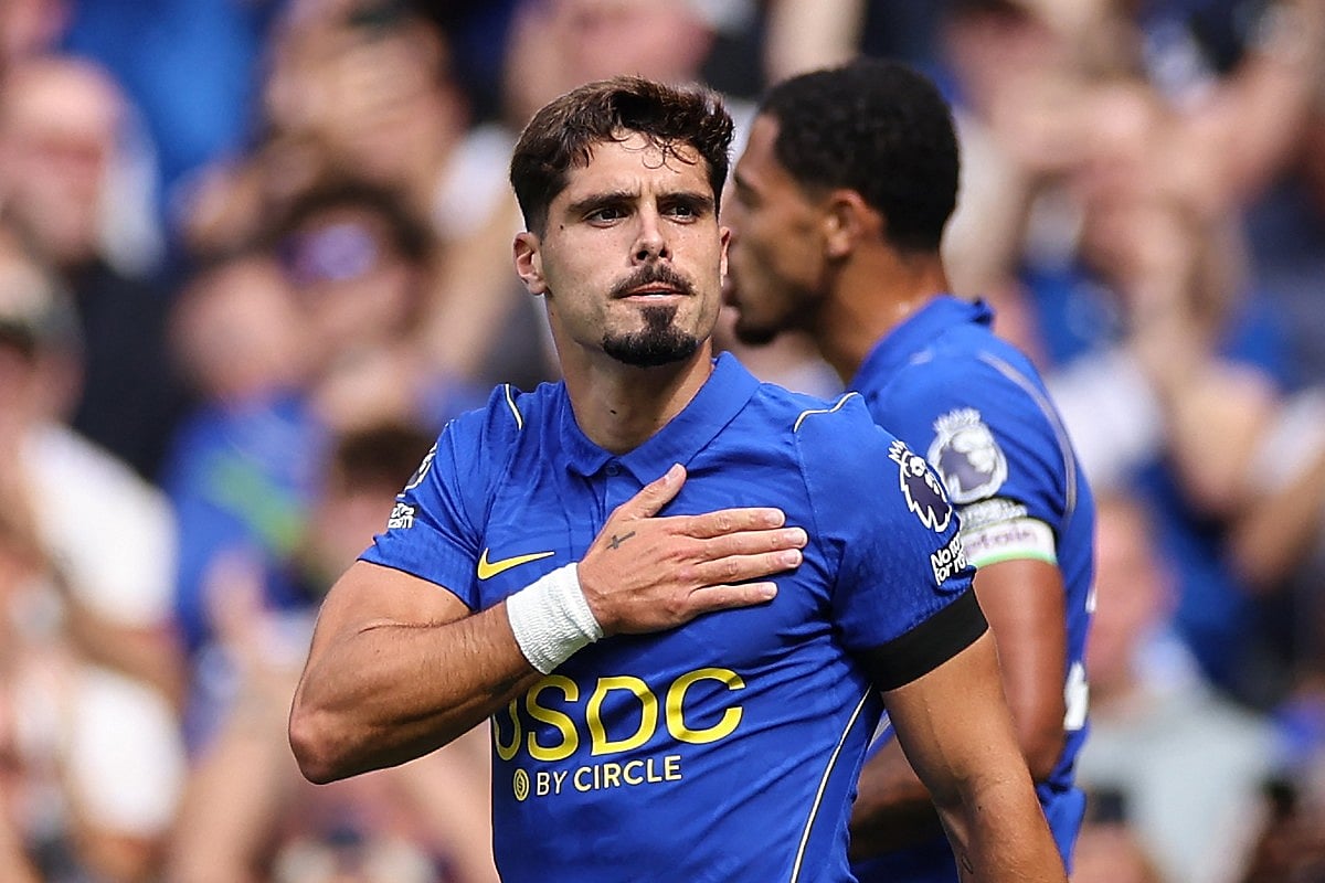 Chelsea's Portuguese midfielder #07 Pedro Neto (R) celebrates after scoring the team's second goal during the English Premier League football match between Chelsea and Brighton and Hove Albion at Stamford Bridge in London on August 30, 2026.
