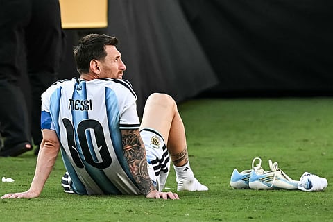 Argentina's forward #10 Lionel Messi reacts after losing during the trophy ceremony at the end of the 2026 World Cup football tournament final match between Spain and Argentina at the New York/New Jersey Stadium in East Rutherford on July 19, 2026.