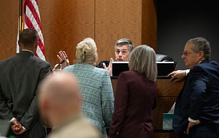 Fourth District Court Judge Tony Graf conferences with attorneys in the case involving Tyler Robinson, charged in the fatal shooting of Charlie Kirk, during closing arguments at his preliminary hearing on September 1, 2026 in Provo, Utah.