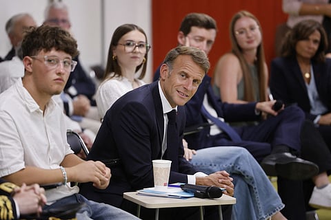 France's President Emmanuel Macron (C) speaks with with students during a visit to the INSPE University on the first day of the new academic year in Mende, southern France on September 1, 2026.