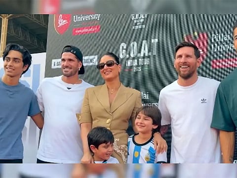 Kareena Kapoor Khan poses with Argentine football legend Lionel Messi during his G.O.A.T India Tour, joined by her sons Taimur Ali Khan and Jehangir Ali Khan.