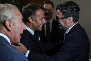 Britain's King Charles III (front L) looks on as France's President Emmanuel Macron (C) meets with Britain's Prime Minister Andy Burnham (R) as they attend a preview event for the Bayeux Tapestry Exhibition, at the British Museum in London on September 2, 2026.
