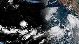This handout satellite image obtained from the National Oceanic and Atmospheric Administration (NOAA)/GOES shows Hurricane Lowell (L), Hurricane Karina (C), and a Tropical Storm Marie (R) over the Pacific Ocean on September 2, 2026, at 15:30 UTC © Handout / NOAA/AFP