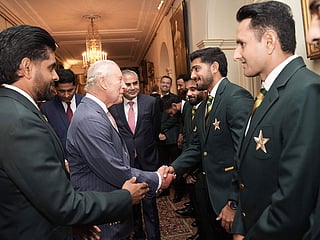 Britain's King Charles III speaks with members of the Pakistan National Cricket Team during an audience at Clarence House, central London.