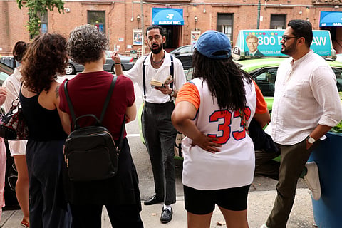 Asad Dandia conducts a guided tour about Malcolm X in the Harlem area of New York on August 22, 2026.