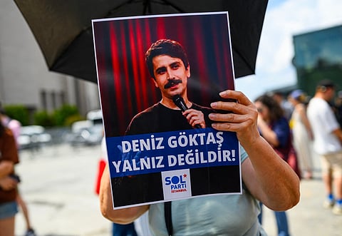 Turkish leftists chant slogans for Turkish comedian Deniz Goktas, who has been detained and brought before the court, holding a banner reading “Deniz Goktas Must Be Freed” in front of Caglayan Courthouse on 03 July, 2026