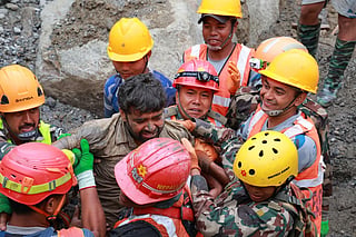 This handout photograph taken and released by the Nepal Army on September 4, 2026 shows army personnel carrying a worker who was trapped inside a tunnel, during a rescue operation at Trishuli-3A Hydropower Project in Nepal's Rasuwa district.