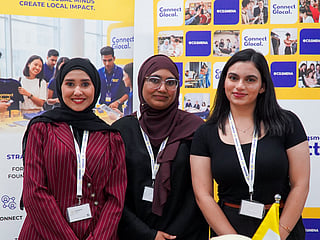 Representatives along with the founder Komal Badar from Global Connect showcase their community platform at the Women of Wisdom 2026 event hosted by Curtin University Dubai