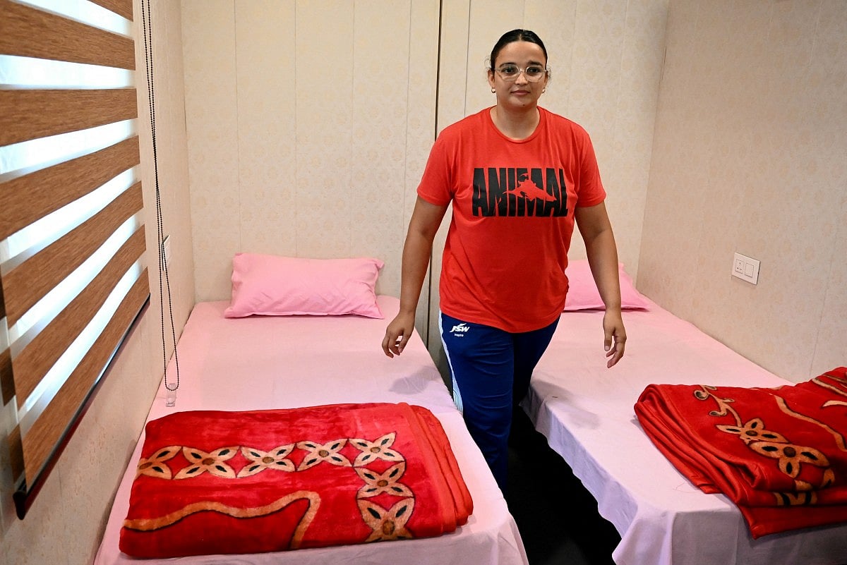 Discus thrower Seema Kaliramna walks between beds inside India’s first container-based accommodation for sportspersons preparing to participate in the upcoming Asian Games Aichi-Nagoya 2026, at Netaji Subhas National Institute of Sports in Patiala on September 4, 2026.