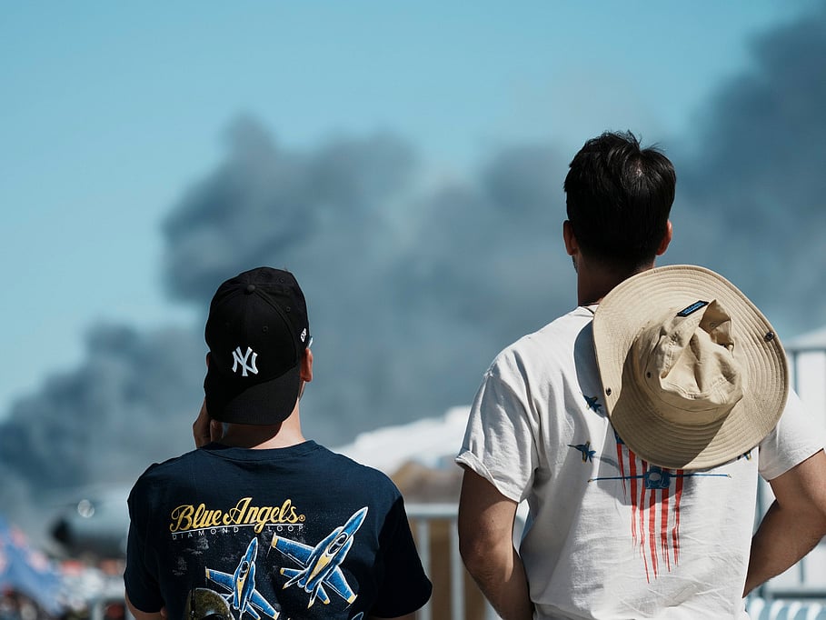 Spectators watch as smoke rises after a Hellenic Air Force F-4 Phantom fighter jet crashed, during the Athens Flying Week airshow at Tanagra Air Force Base, north of Athens, Greece, Saturday, Sept. 5, 2026.  Photo/Kallista Allaway)