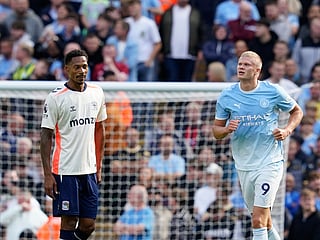Manchester City's Erling Haaland, right, celebrates after scoring his side's opening goal during the English Premier League soccer match between Manchester City and Coventry City in Manchester, England, Saturday, Sept. 5, 2026. 