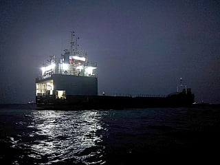 A vessel transits the Strait of Hormuz off the coast of the port city of Bandar Abbas in southern Iran. 