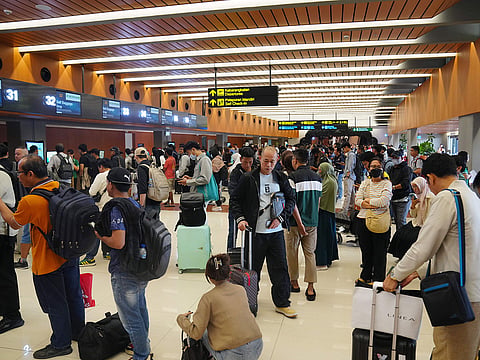 Travelers queue up for check in at Soekarno-Hatta International Airport in Tangerang, Indonesia.
