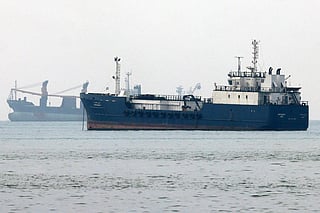 Vessels transit the Hormuz Strait off the coast of Iran's southern port city of Bandar Abbas.