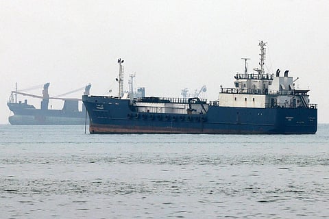 Vessels transit the Hormuz Strait off the coast of Iran's southern port city of Bandar Abbas.