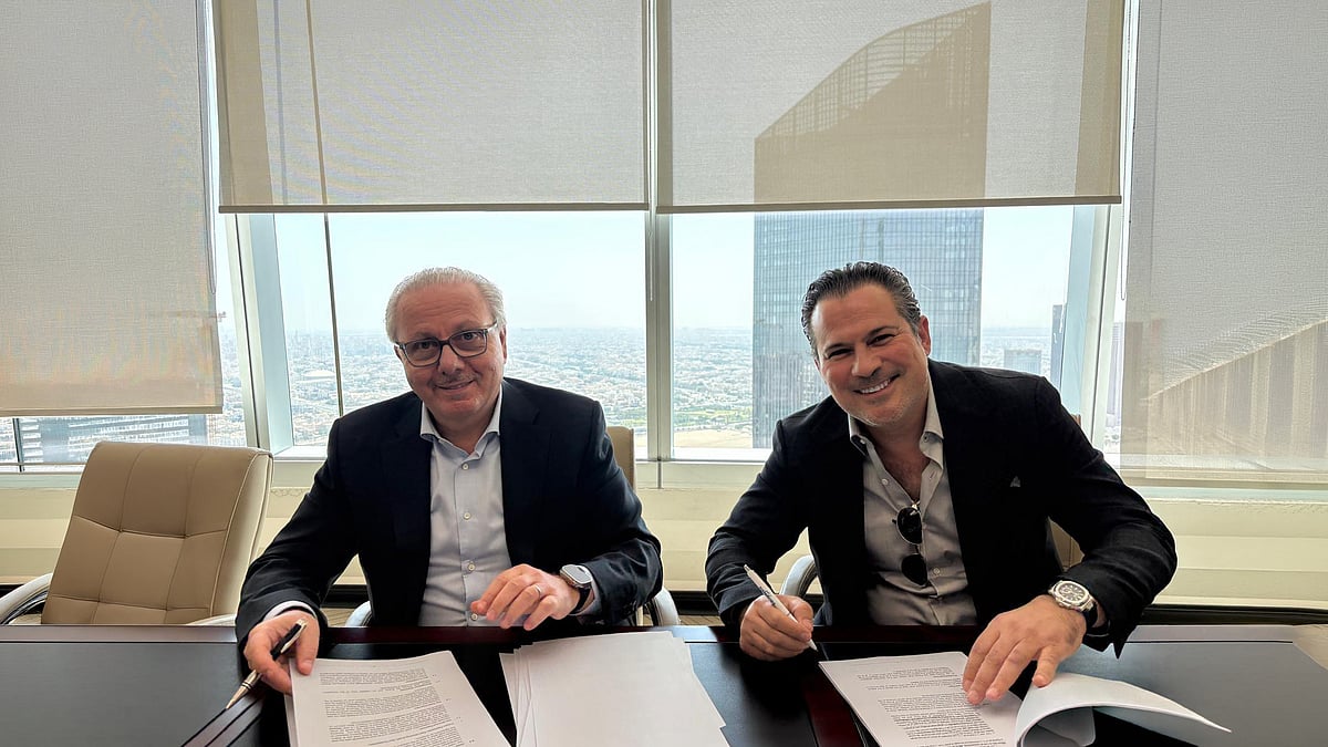 Nagib Bahous (left) and Ibrahim Arqawi during the signing ceremony.