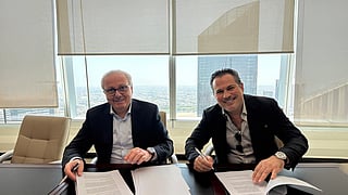 Nagib Bahous (left) and Ibrahim Arqawi during the signing ceremony.