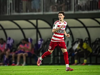 The teenager was welcomed to the game in added-time 