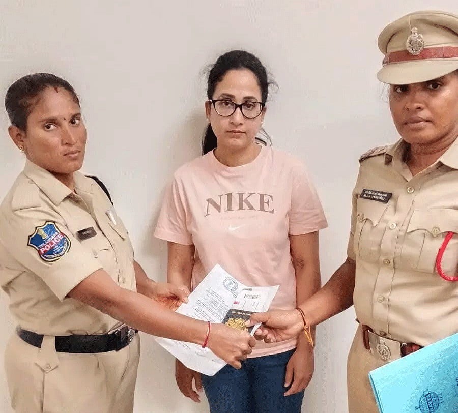 Nandana with police following her detention at Hyderabad airport in connection with an alleged UK jobs and visa fraud case.