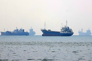 Vessels transit the Hormuz Strait off the coast of Iran's southern port city of Bandar Abbas on September 7, 2026.