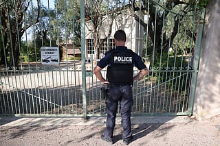 A police officer stands in front of the entrance of the Musee Renoir after four paintings, valued at nine million euros, were stolen from the museum in an early-morning break-in, with two suspects still at large, in Cagnes-sur-Mer on September 8, 2026.