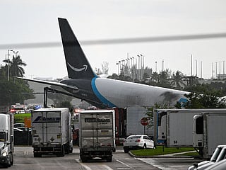 The tail section of a cargo plane is seen at Miami International Airport after it overran the runway at Miami International Airport in Miami, Florida.