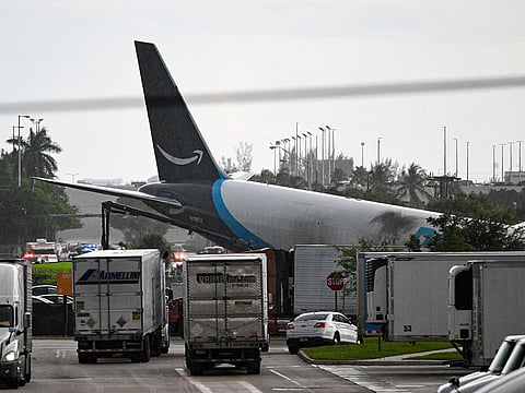 The tail section of a cargo plane is seen at Miami International Airport after it overran the runway at Miami International Airport in Miami, Florida.
