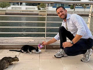Gianluca Santangelo on his daily run feeding the community's stray cats