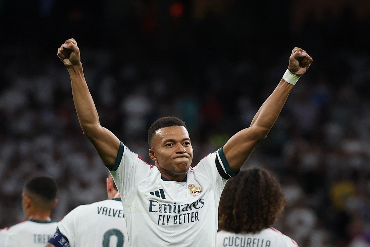 Real Madrid's French forward #10 Kylian Mbappe celebrates scoring his team's first goal during the UEFA Champions League first round day 1 football match between Real Madrid and Inter Milan at the Santiago Bernabeu stadium in Madrid on September 8, 2026.